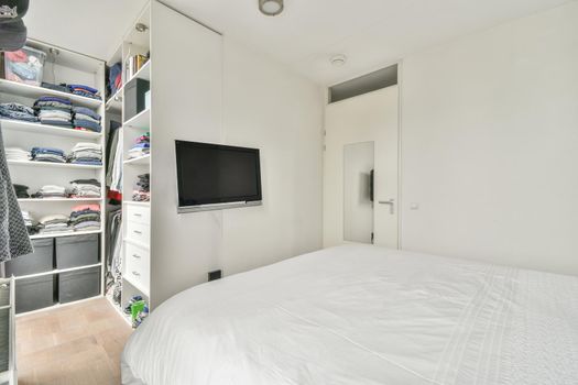 Stylish interior of contemporary room with comfortable bed
