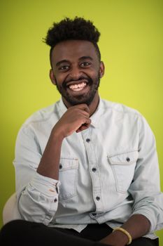 African student using laptop computer to study and make business connections ufo green background