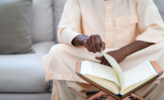 african muslim couple at home in ramadan reading quran holly islam book