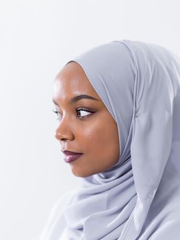 portrait of young modern muslim afro beauty wearing traditional islamic clothes on white background