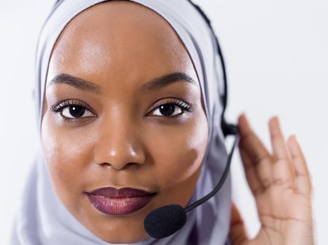 African muslim female with hijab scarf customer representative business woman with phone headset helping and supporting online with customer in modern bright call centre isolated on white background