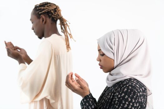 african muslim couple praying Allah by raising hands and making fatiha pray