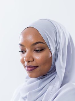 portrait of young modern muslim afro beauty wearing traditional islamic clothes on white background