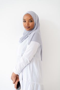 young modern muslim african business woman using smartphone wearing hijab clothes isolated on white background