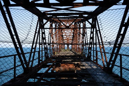 the design of an old rusty dilapidated bridge