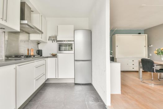 Beautifully laid gray tiled floors in a stylish kitchen