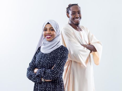 portrait of young african modern muslim couple wearing traditional clothes isolated on white background