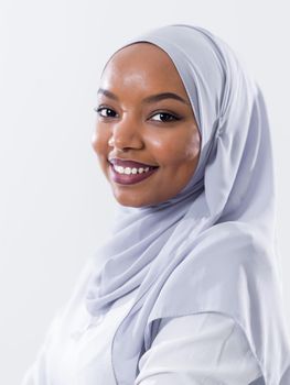 portrait of young modern muslim afro beauty wearing traditional islamic clothes on white background