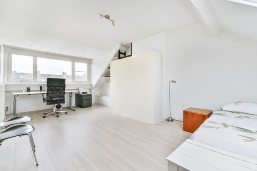 Single soft bed in the bedroom with parquet floor