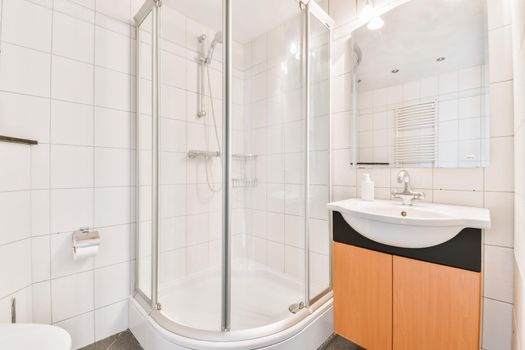 Luxurious shower cubicle with closing doors in an elegant apartment