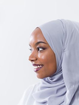 portrait of young modern muslim afro beauty wearing traditional islamic clothes on white background