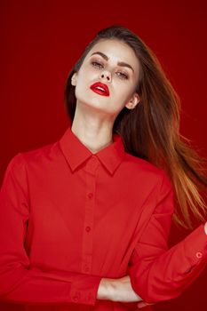 woman in red shirt posing fashion red lips fun. High quality photo