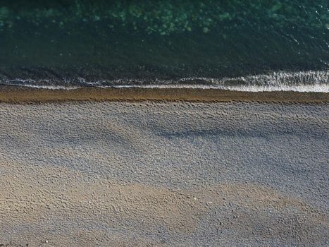 Aerial panoramic view of beautiful sunset above sea. Beautiful seascape. Sun glare, small waves on the water surface. Evening. Horizon. Nobody. No people. Copy space. Never-ending beauty of nature