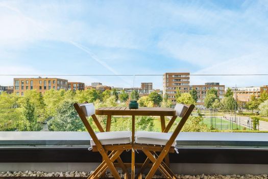 Stunning balcony with wooden table and chairs and mesmerizing views