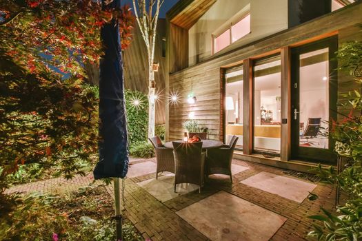 Courtyard with full of greenery and wicker chairs