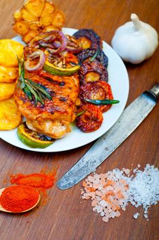 roasted grilled BBQ chicken breast with herbs and spices rustic style