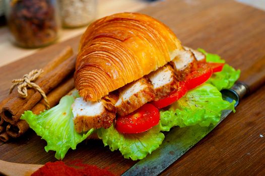 savory croissant brioche bread with chicken breast and vegetable rustic style 