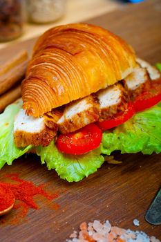 savory croissant brioche bread with chicken breast and vegetable rustic style 