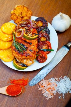 roasted grilled BBQ chicken breast with herbs and spices rustic style