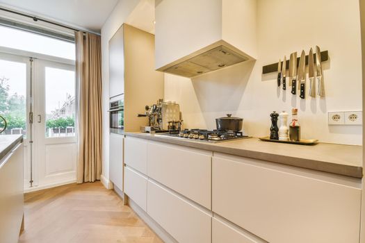 Stylish and modern kitchen with white kitchen unit