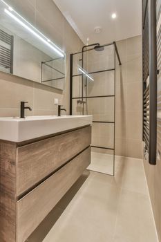 Stylish bathroom in a minimalist style in beige and black tones