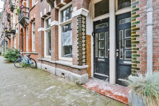 Residential building front door with black doors
