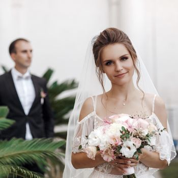 Wedding portrait of a smiling bride and groom. High quality photo