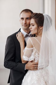 Wedding portrait of a smiling bride and groom. High quality photo