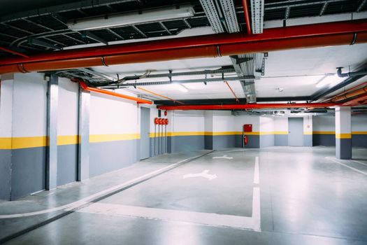 Corridor of a large heated underground car park. High quality photo