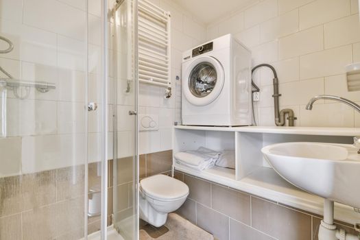 Delightful bathroom with radiator and washing machine
