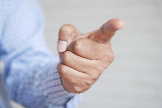 Businessman in suit point finger at camera