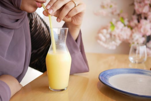 pineapple juice in a bottle on table .