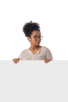 Happy afro american woman showing blank board over white background
