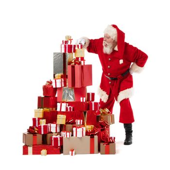 Santa Claus putting heap pile of gifts isolated on white background
