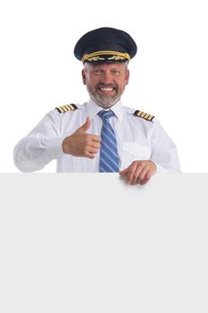 Portrait of happy smiling pilot holds blank banner isolated on white background