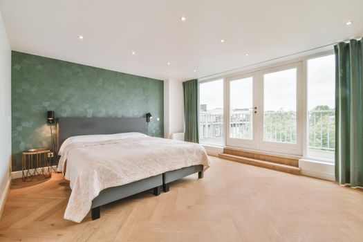Elegant and cozy bedroom with a double soft bed