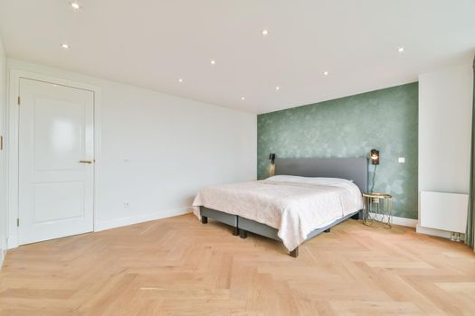 Elegant and cozy bedroom with a double soft bed