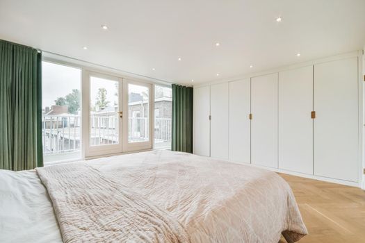 Elegant and cozy bedroom with a double soft bed