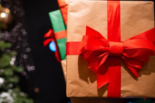 Gift boxes with ribbons of different colors, close angle