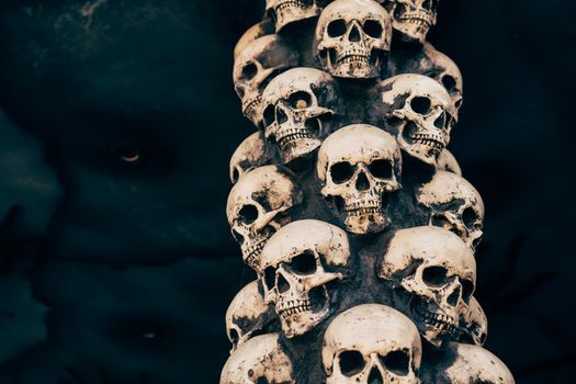 Skull Halloween Background Many People Skulls Stand on top of each other. Mystic creepy concept. Abstract nightmare occult memorial.