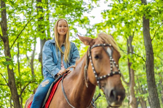 Beautifulwoman riding a horse in countryside.