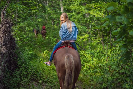 Beautifulwoman riding a horse in countryside.