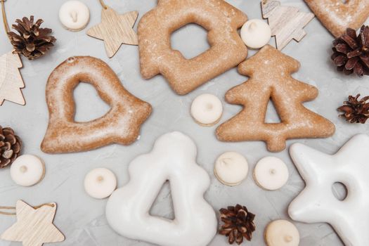 Banner for Christmas and New Year gingerbread stars, houses, Christmas trees, toys on a gray concrete background