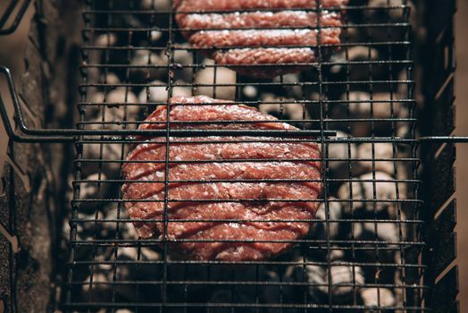 Fresh meat cutlets in a frying grill. Close view.