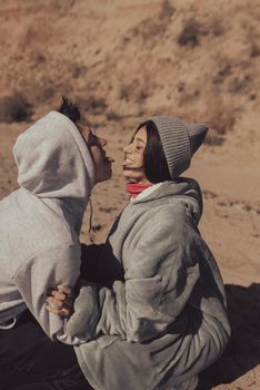 A man and a woman enjoy each other on the seashore. Have fun together