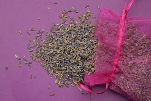 lavender dry leaf on purple background .