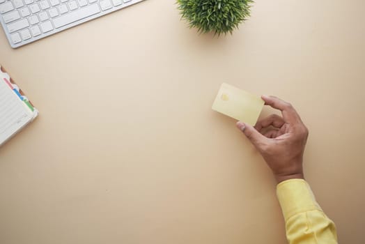 close up of person hand holding credit card.