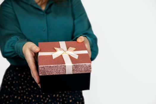Young woman giving sparkling gift box isolated on white background, Female,Valentines Day, Birthday,Mothers Day and present concept copy space space for text