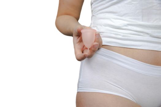 Young female holding menstrual isolated on white background, device into vagina with menstruation, Environmental,woman concept copy space