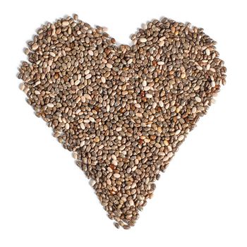 Top view on chia (Salvia hispanica) seeds arranged in shape of heart, isolated on white background. Food for healthy cardiovascular system concept.